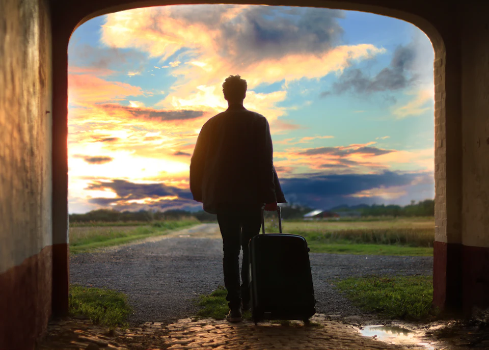 Man holding luggage photo
