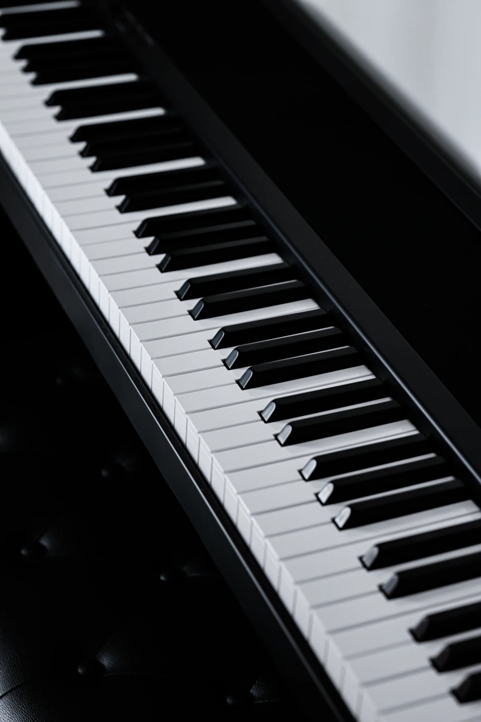 A close up of a piano keyboard on a table