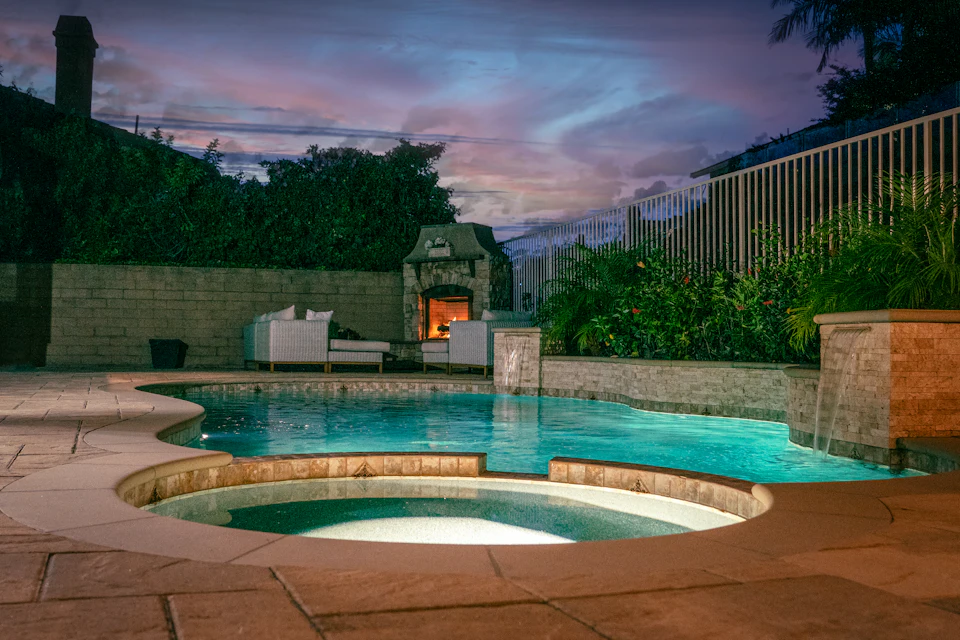 A swimming pool with a building in the background