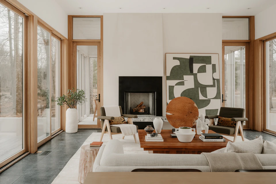 Modern living room with fireplace and large windows